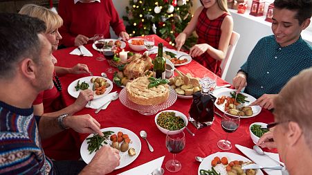 A family eating vegan Christmas dinner