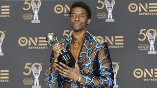 Chadwick Boseman, a cast member in Black Panther, poses at the premiere of the film in Los Angeles.