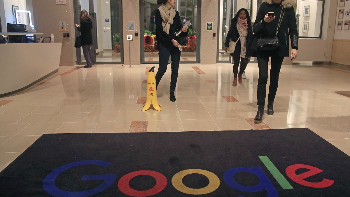 Google employees walks out of the entrance hall of Google France in Paris, Monday, Nov. 18, 2019. (AP Photo/Michel Euler)

                            