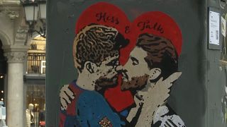 Graffiti in Barcelona shows El Clasico rivals kissing