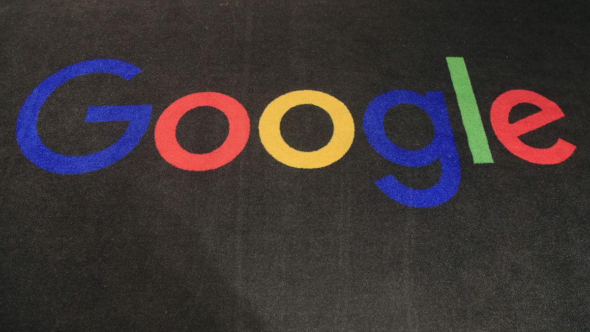 The logo of Google is displayed on a carpet at the entrance hall of the company's French headquarters in Paris.
