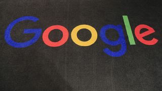 The logo of Google is displayed on a carpet at the entrance hall of the company's French headquarters in Paris.