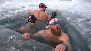 Russian ice divers put up New Year's tree in Lake Baikal
