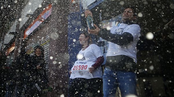 Winners cash in €400,000 in Spain's traditional Christmas lottery Winners cash in €400,000 in Spain's traditional Christmas lottery