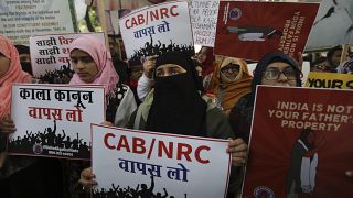 Hundreds march in New Delhi against citizenship law that excludes Muslims