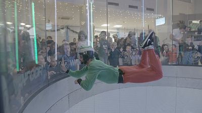 Watch: Indoor sky-diving elf draws Christmas lottery numbers in windtunnel