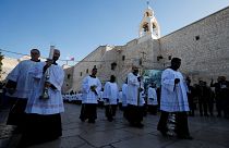 Clergymen attend Christmas celebrations at Manger Square outside the Church of the Nativity in Bethlehem, in the Israeli-occupied West Bank December 24, 2019.
