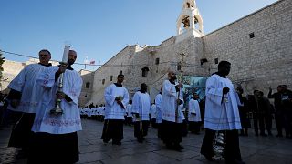 Clergymen attend Christmas celebrations at Manger Square outside the Church of the Nativity in Bethlehem, in the Israeli-occupied West Bank December 24, 2019. 
