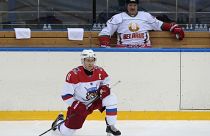 Putin dons skates to play ice hockey in Moscow
