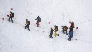 Rescue forces search for missing people after an avalanche swept down a ski piste in the central town of Andermatt, canton Uri, Switzerland.