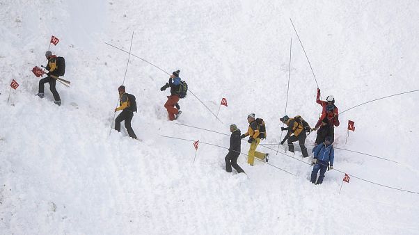 Rescue forces search for missing people after an avalanche swept down a ski piste in the central town of Andermatt, canton Uri, Switzerland. Rescue forces search for missing people after an avalanche swept down a ski piste in the central town of Andermatt, canton Uri, Switzerland.