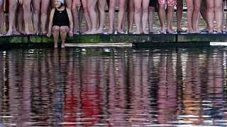 Swimmers prepare to take part in the annual Christmas Day Peter Pan Cup handicap race in the Serpentine River, in Hyde Park, London, Britain. 25 December, 2019.