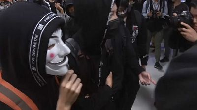 Anti-government protesters in Hong Kong clash with police
