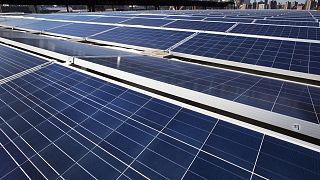A rooftop is covered with solar panels at the Brooklyn Navy Yard, Tuesday, Feb. 14, 2017, in New York