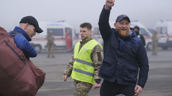 A pro-Russian prisoner celebrates during an exchange close to the Maiorske checkpoint, Donetsk. A pro-Russian prisoner celebrates during an exchange close to the Maiorske checkpoint, Donetsk.