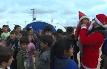 Activists distribute Christmas presents at camp for displaced Syrian children
