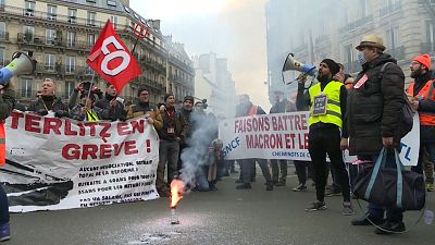 French pension strikers and Gilets Jaunes march together on 24th day of action