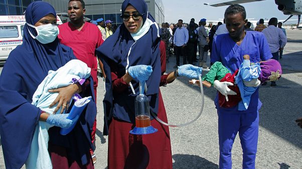 Medical personnel carry wounded children to be airlifted to the Turkish capital for treatment after they were injured in Saturday's car bomb blast in Mogadishu, Somalia. Medical personnel carry wounded children to be airlifted to the Turkish capital for treatment after they were injured in Saturday's car bomb blast in Mogadishu, Somalia.