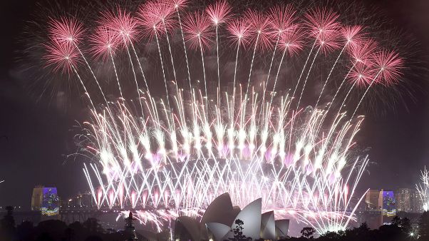 In this Sunday, Jan. 1, 2017 photo, fireworks explode over the Sydney Opera House and Harbour Bridge as New Year's celebrations are underway in Sydne. (AP Photo/Rick Rycroft, In this Sunday, Jan. 1, 2017 photo, fireworks explode over the Sydney Opera House and Harbour Bridge as New Year's celebrations are underway in Sydne. (AP Photo/Rick Rycroft,