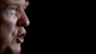 President Donald Trump speaks to members of the media following a Christmas Eve video teleconference with members of the military at his Mar-a-Lago estate in Palm Beach