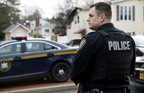A Ramapo police officer directs traffic outside of a rabbi's residence in Monsey, N.Y.