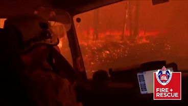 Terrifying moment as Australian firefighters drive through flames