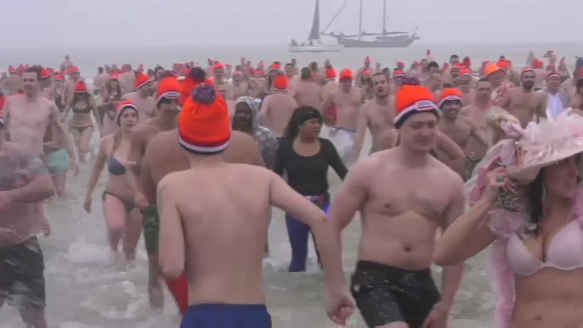 Dutch courage: Thousands plunge into North Sea for New Year's Day dip