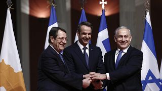 Greece’s Prime Minister Kyriakos Mitsotakis, center, Cypriot President Nicos Anastasiadis left and Israeli Prime Minister Benjamin Netanyahu