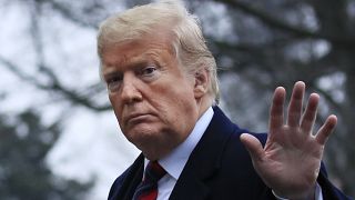 President Donald Trump walks on the South Lawn upon arrival at the White House in Washington, Saturday, Jan. 19, 2019.