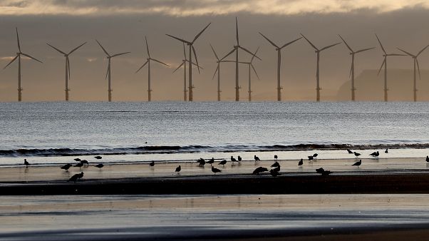 An offshore wind farm is visible from the beach in Hartlepool, England, Tuesday, Nov. 12, 2019. An offshore wind farm is visible from the beach in Hartlepool, England, Tuesday, Nov. 12, 2019.