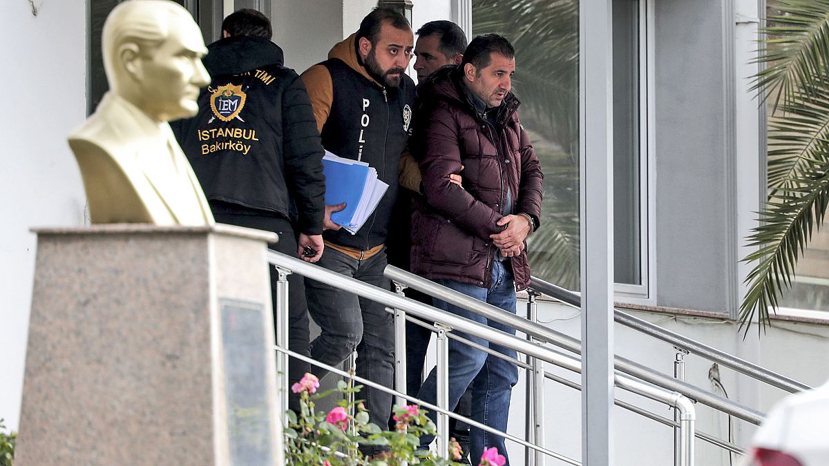 The unidentified suspects were pictured being detained by police in Istanbul