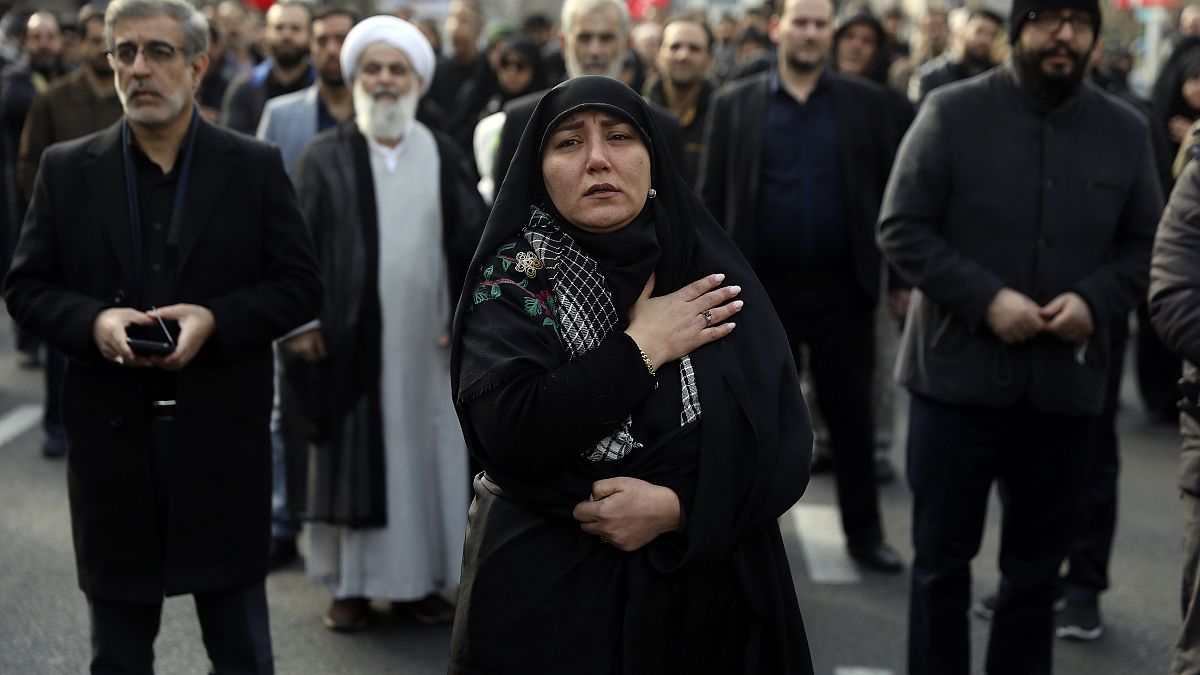 A woman mourns in a demonstration over the U.S. airstrike in Iraq that killed Iranian Revolutionary Guard Gen. Qassem Soleimani in Tehran, Iran, Jan. 3, 2020. 
