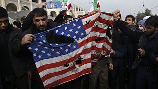 Protesters burn a U.S. flag during a demonstration over the U.S. airstrike in Iraq that killed Iranian Revolutionary Guard Gen. Qassem Soleimani, in Tehran, Iran, Jan. 3, 2020