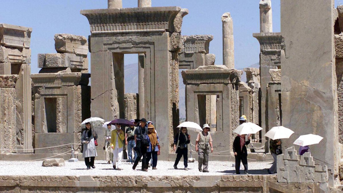 Japanese tourists visit Iran's Persepolis, 460 miles south of Tehran