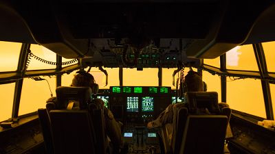 The flight deck of a C-130J Hercules aircraft prepares to land at Merimbula airfield to deploy Fire and Rescue crews. The flight deck of a C-130J Hercules aircraft prepares to land at Merimbula airfield to deploy Fire and Rescue crews.