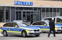Police cars park in front of a police station in Gelsenkirchen, Germany.