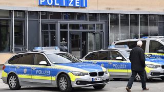 Police cars park in front of a police station in Gelsenkirchen, Germany.