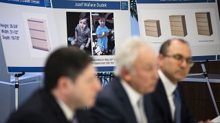 Placards showing images of Jozef Dudek and IKEA's Malm dressers are displayed during a news conference in Philadelphia, Monday, Jan. 6, 2020. 