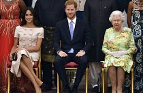 Queen Elizabeth II with the Duke and Duchess of Sussex at the Queen's Young Leaders Awards Ceremony at Buckingham Palace, London, Tuesday June 26, 2018.