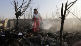 A rescue worker searches the scene where an Ukrainian plane crashed in Shahedshahr, southwest of the capital Tehran, Iran, Wednesday, Jan. 8, 2020. 