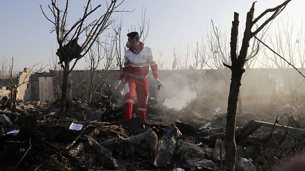 A rescue worker searches the scene where an Ukrainian plane crashed in Shahedshahr, southwest of the capital Tehran, Iran, Wednesday, Jan. 8, 2020. A rescue worker searches the scene where an Ukrainian plane crashed in Shahedshahr, southwest of the capital Tehran, Iran, Wednesday, Jan. 8, 2020.