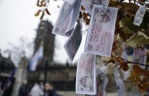 Fake 350 million pound notes bearing the face of then Prime Minister Boris Johnson, placed by anti-Brexit protesters outside the Houses of Parliament in London, Jan. 7, 2020.