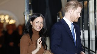 Britain's Prince Harry and Meghan, Duchess of Sussex leave after visiting Canada House in London, Tuesday Jan. 7, 2020