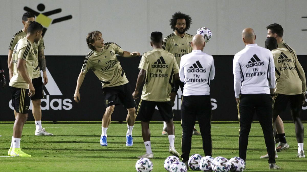 Real Madrid players warm up during a training session in Jiddah, Saudi Arabia