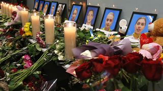 Tributes are placed in front of portraits of the flight crew members of the downed Ukrainian plane, in Borispil international airport, near Kyiv, Jan. 11, 2020.