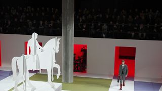 A model wears a creation as part of the Prada men's Fall-Winter 2020/21