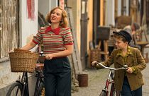 Scarlett Johansson and Roman Griffin Davis in the film JOJO RABBIT.