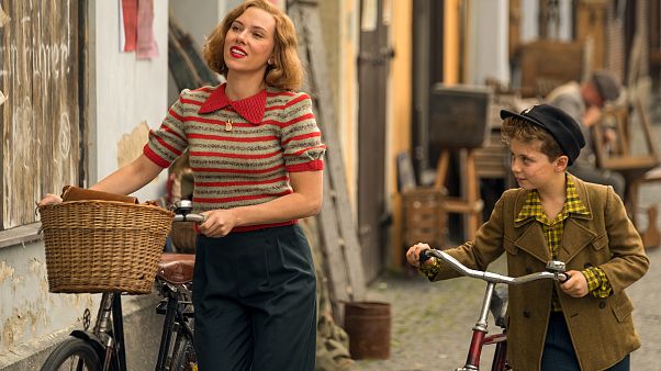 Scarlett Johansson and Roman Griffin Davis in the film JOJO RABBIT