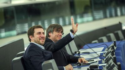 Catalan leaders Carles Puigdemont and Antoni Comin attend a plenary in the hemicycle of the European Parliament in Strasbourg