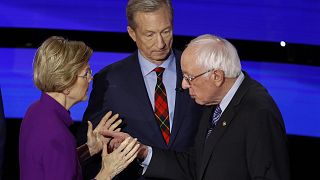 Democratic presidential candidate Sen. Elizabeth Warren, D-Mass., and Sen. Bernie Sanders, I-Vt., talk Tuesday, Jan. 14, 2020, after a Democratic presidential primary debate